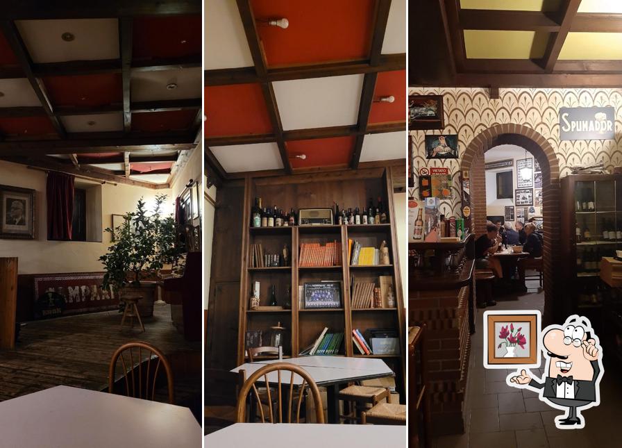 Dai un'occhiata agli interni di Taverna del Falco