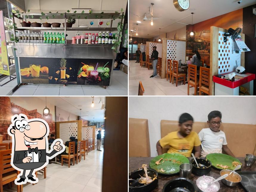 Take a seat at one of the tables at TOPI VAPPA BIRIYANI KUMBAKONAM BRANCH