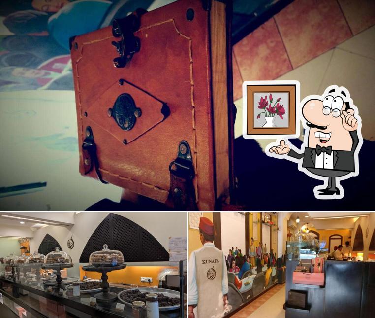 Take a seat at one of the tables at Kunafa