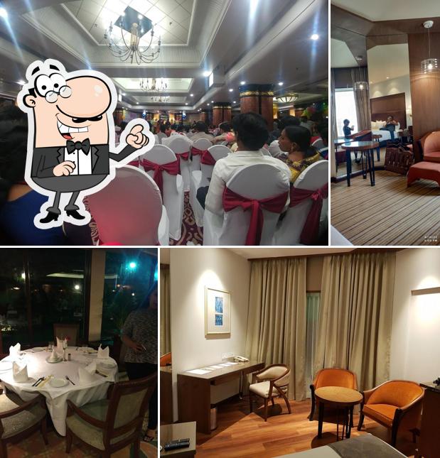 Take a seat at one of the tables at Welcomhotel By ITC Hotels, Devee Grand Bay, Visakhapatnam