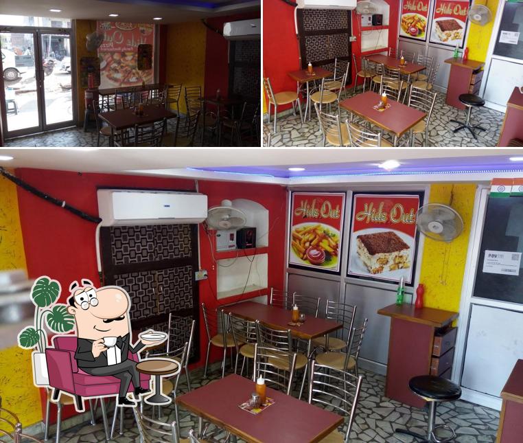 Take a seat at one of the tables at Hide Out pizza