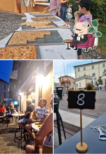 Guarda la immagine che mostra la interni e cibo di Tatanka pizza d'asporto