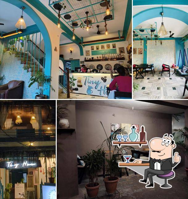 Take a seat at one of the tables at Tiny House Cafe