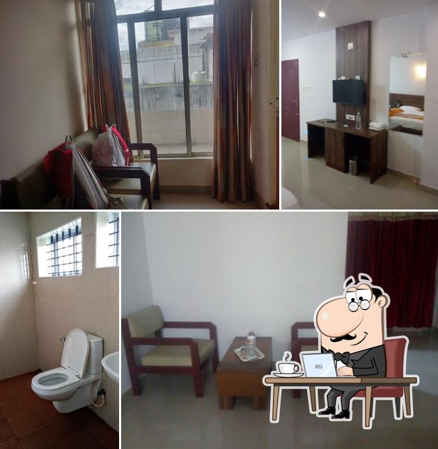 Take a seat at one of the tables at Hotel Amma Residency