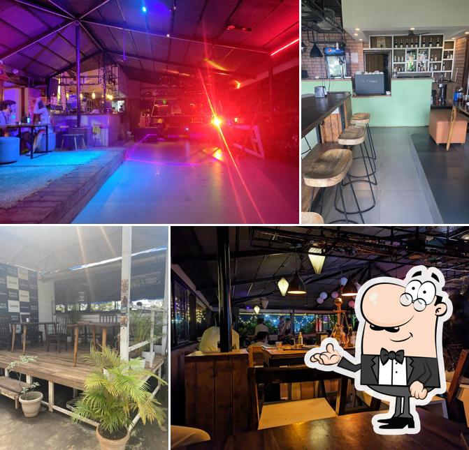 Take a seat at one of the tables at Glam And Grill - Restaurant Coworking Pub