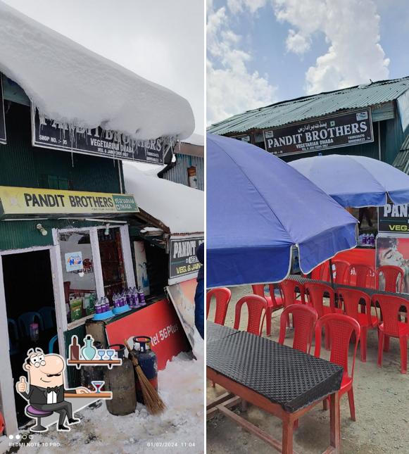 Take a seat at one of the tables at Pandit Brothers Vegetarian Dhaba/jain food also available