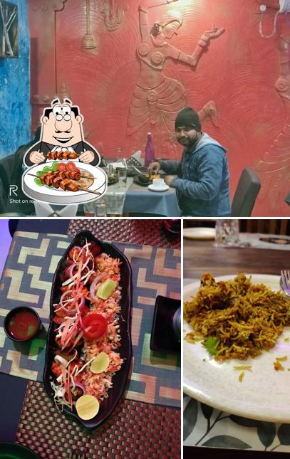 Among various things one can find food and dining table at NAIVEDYAM