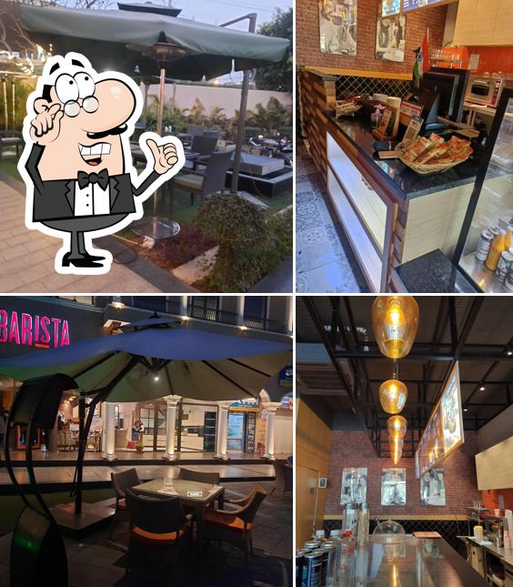 Take a seat at one of the tables at Barista - Sunview Enclave