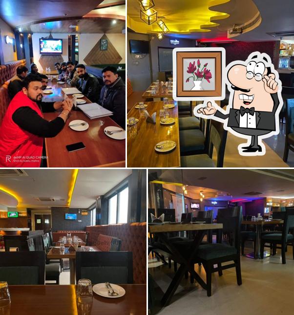 Take a seat at one of the tables at Eden Kitchen & Bar - Best bar and restaurant in noida
