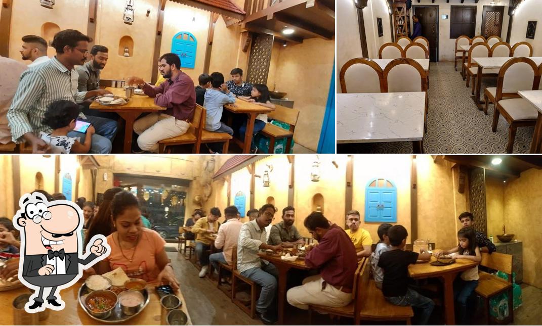 Take a seat at one of the tables at Majghar - Lalbaug