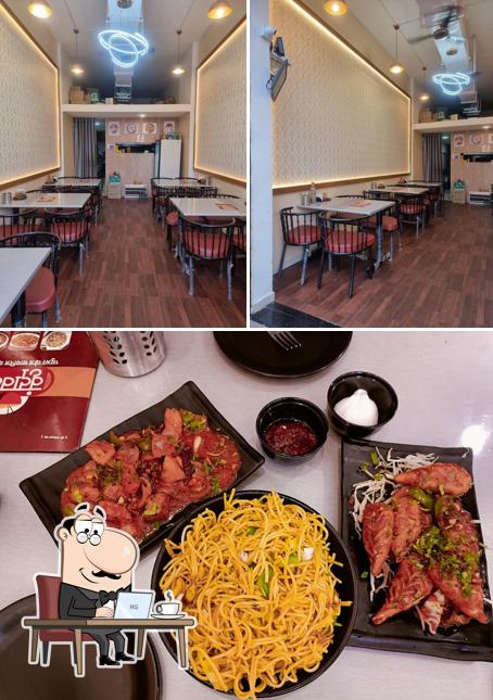 Check out the image showing interior and food at Vrundavan Pure Veg Chinese and Momos