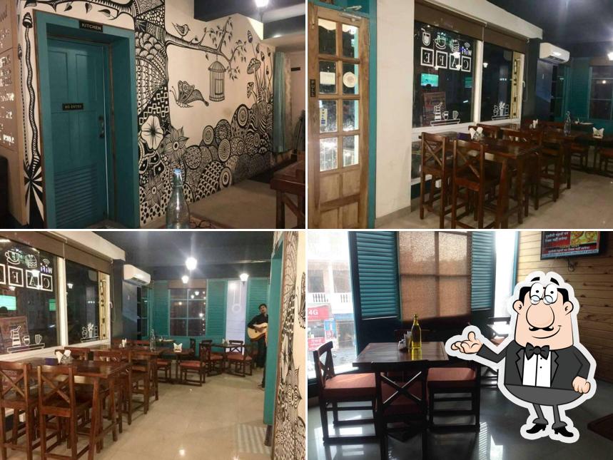 Take a seat at one of the tables at Mystical Cafe