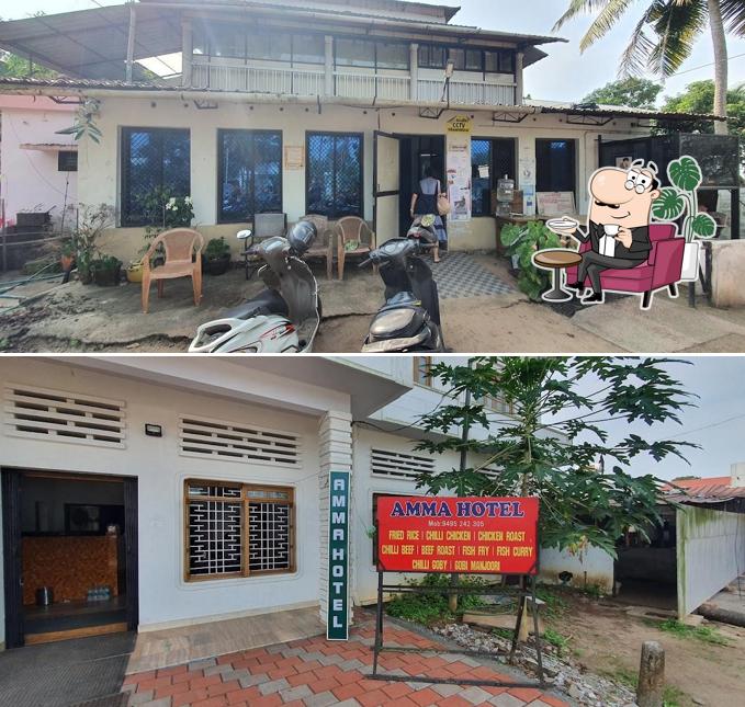 Take a seat at one of the tables at Amma Hotel