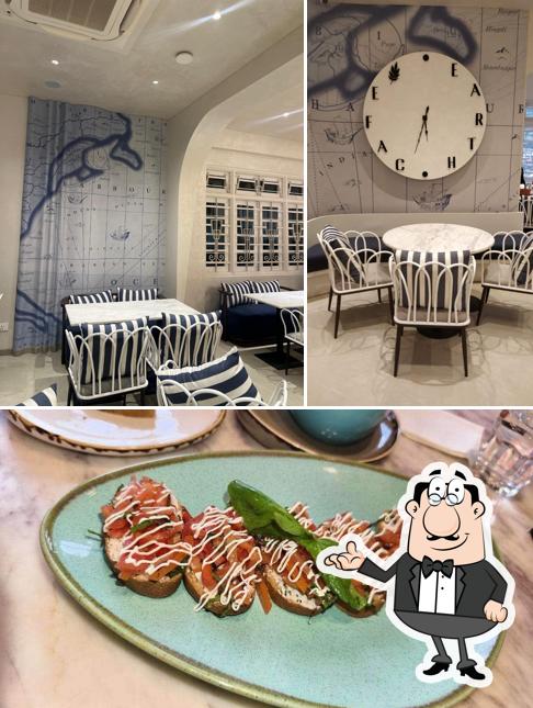 Check out the photo showing interior and beverage at Earth Cafe @ Churchgate