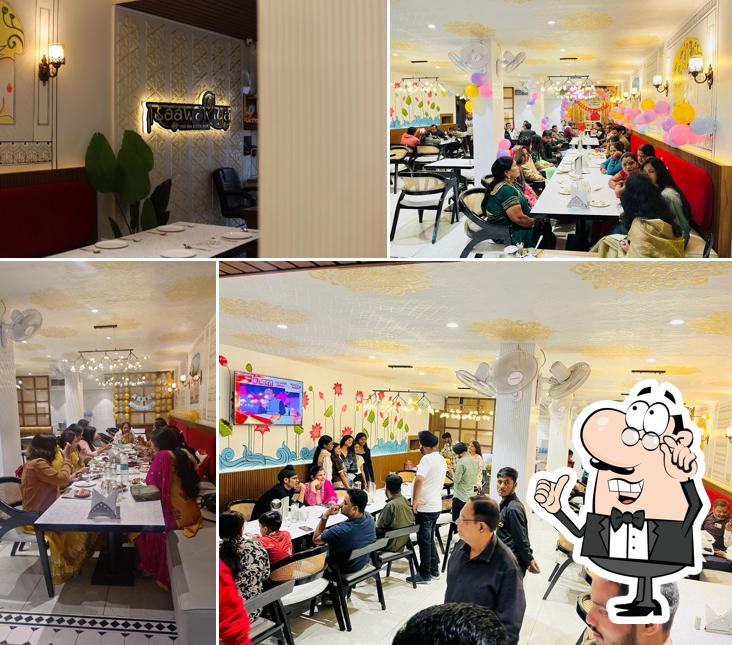 Take a seat at one of the tables at Saawariya Restaurant & Caterers