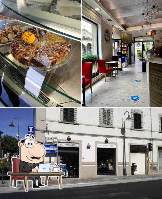 La foto della interni e cibo di New Bar L'angolo