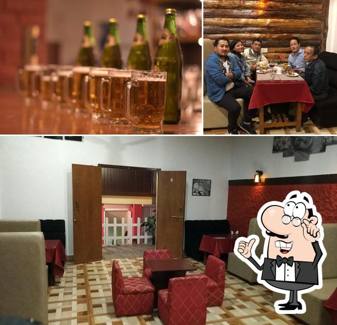 The photo of The Hood Bar and Restaurant’s interior and beer