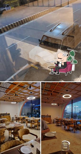 Take a seat at one of the tables at Ayodhya Restaurant