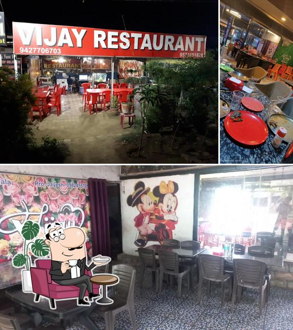 Check out the picture showing interior and food at Vijay Restaurant Suratwala since 1970