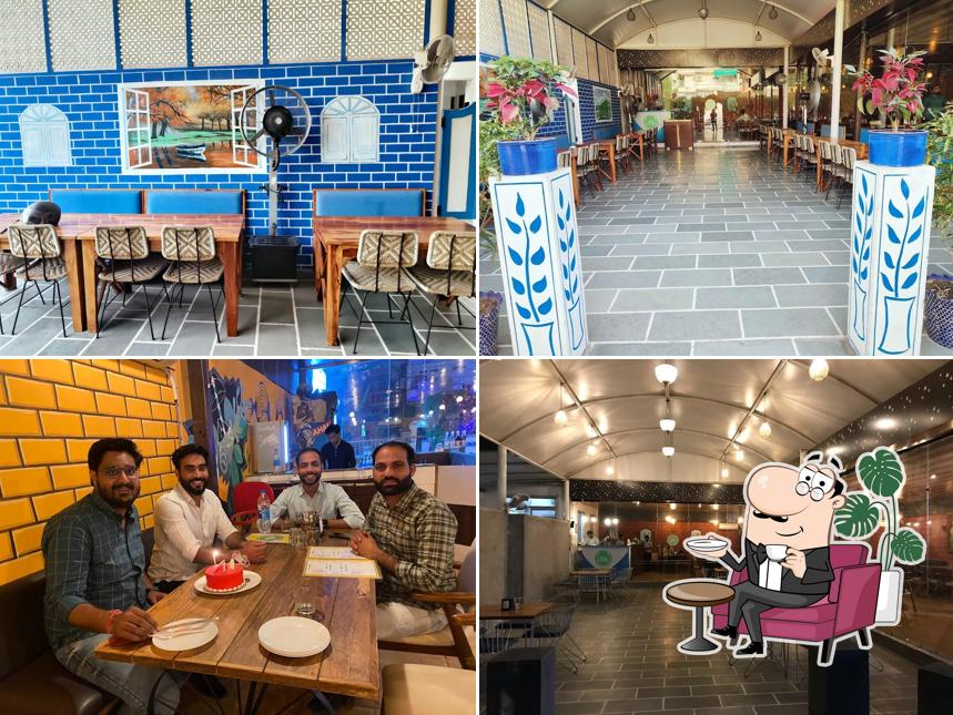 Take a seat at one of the tables at Dhaba Delight (Veg Restaurant)