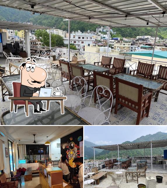 Take a seat at one of the tables at Spontrail Hostel & Cafe