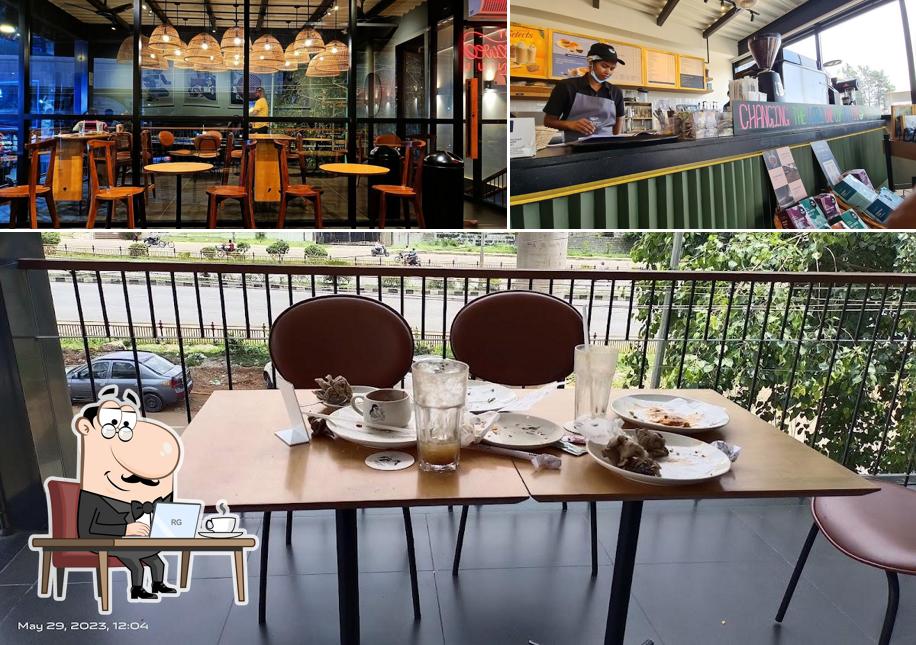 Take a seat at one of the tables at Third Wave Coffee