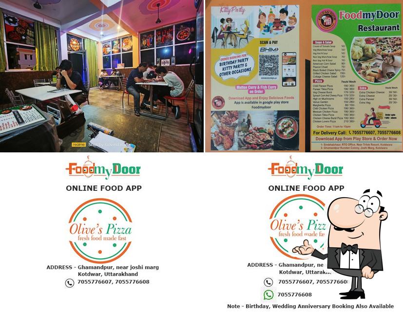 Take a seat at one of the tables at FOODMYDOOR - Best food restaurant in kotdwar