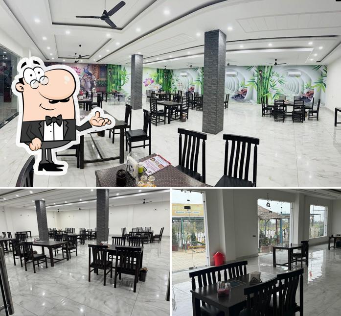 Take a seat at one of the tables at Shere-e-punjab restruant ਸ਼ੇਰੇ ਪੰਜਾਬ ਰੈਸਟੋਰੈਂਟ