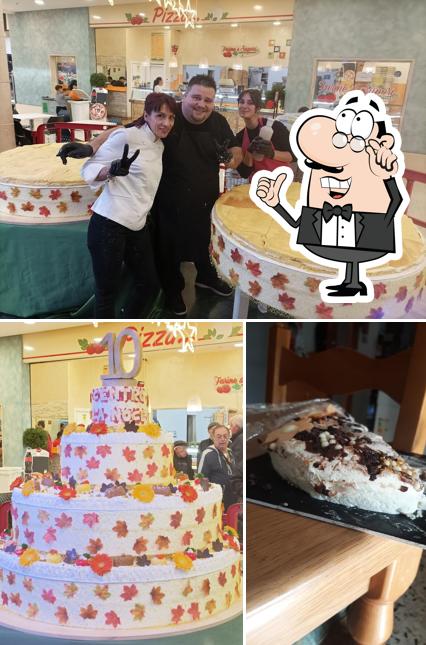 Il kremino gelateria pasticceria si caratterizza per la interni e cibo