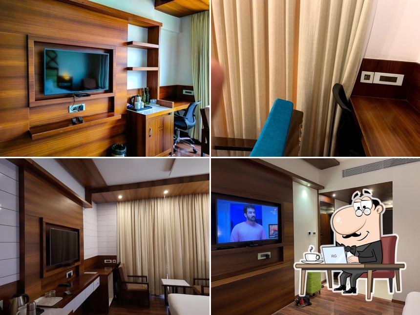 Take a seat at one of the tables at Hotel Preethi International