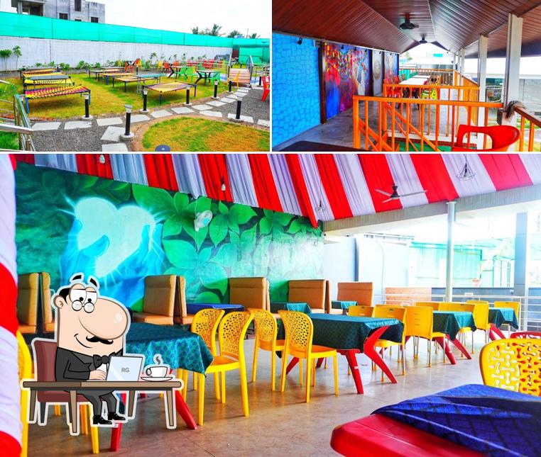 Take a seat at one of the tables at Hotel Rangila Punjab Family Restaurant