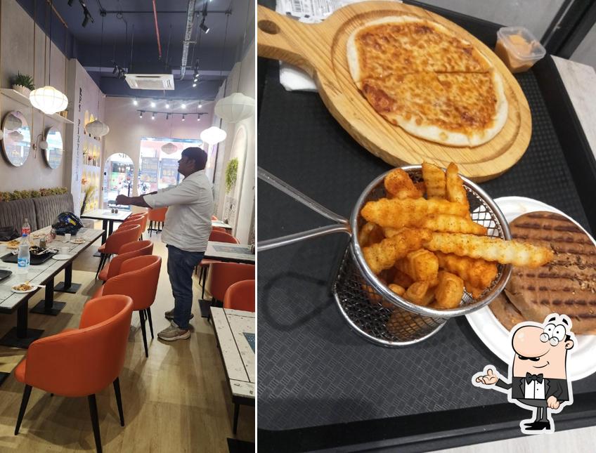 Take a seat at one of the tables at RP’s PIZZARIA BROWN BURGER CO