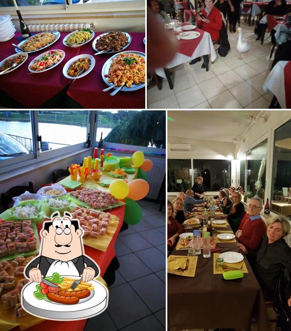 La immagine di cibo e tavolo da pranzo da Ristorante Pizzeria Laghi Tuca Tuca