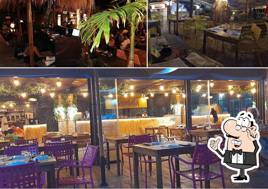 Siediti a un tavolo di Mandala Ristorante Pizzeria