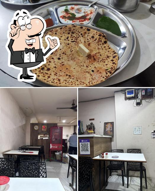 This is the photo showing interior and food at Agarawal Paratha Corner
