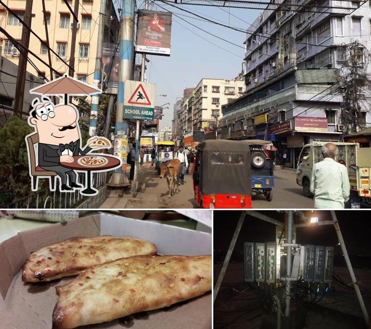 Take a look at the picture displaying exterior and food at Domino's Pizza RD Mall, Howrah