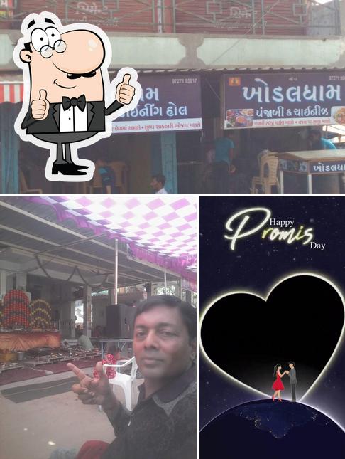 Look at the photo of Khodaldham Dinning Hall