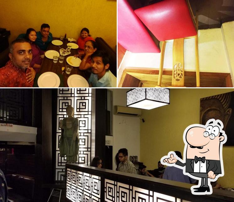 Take a look at the image showing interior and dining table at 5 Spice