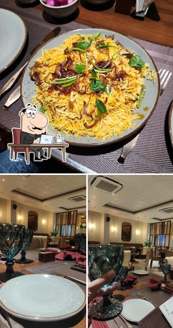 Take a seat at one of the tables at MUGH CHI RESTAURANT