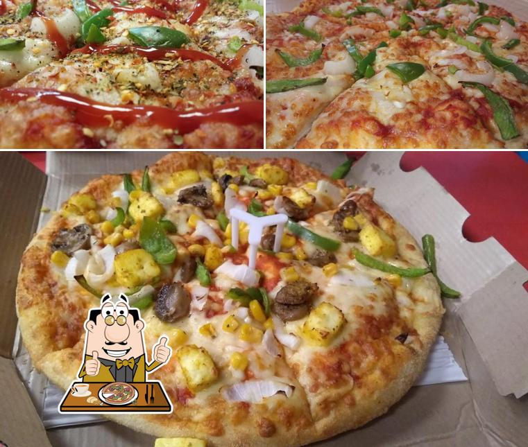At Domino's Pizza Nizampura, Vadodara, you can enjoy pizza