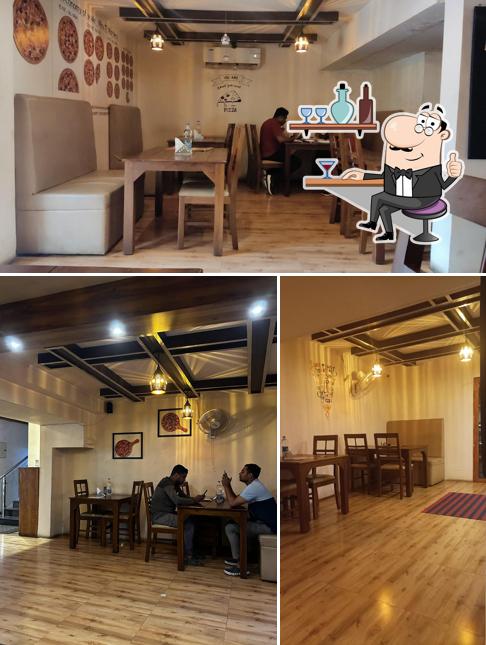 Take a seat at one of the tables at Sijis Pizza Street