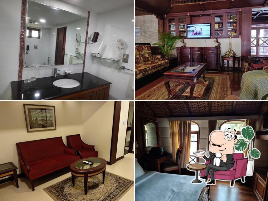 Take a seat at one of the tables at Sterling Lake Palace Alleppey