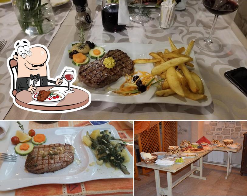 Prenditi i un pasto a base di carne a Murvica Guest House, Restaurant, Eco-products and Accommodation