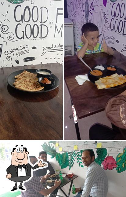 The photo of Grill and cheese cafe’s interior and pizza