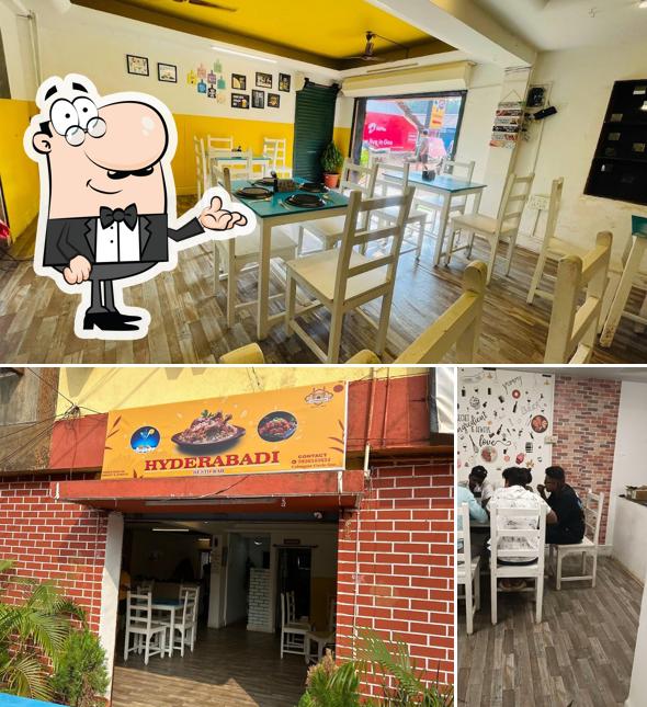 Take a seat at one of the tables at Hyderabadi Resto Bar