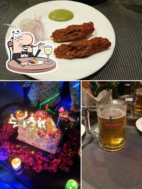 This is the photo showing food and beer at Nizam E Khaas