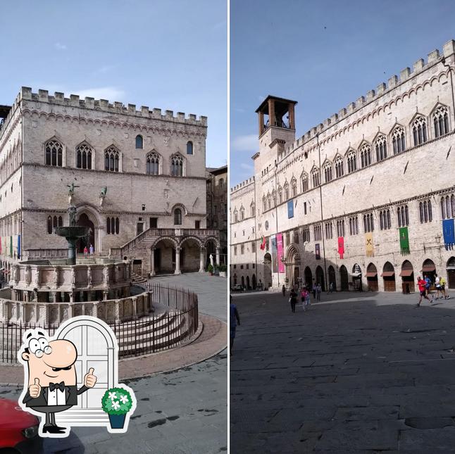 Puoi goderti l'aria fresca da seduto all'esterno di Bar caffè stuzzicheria del grifo
