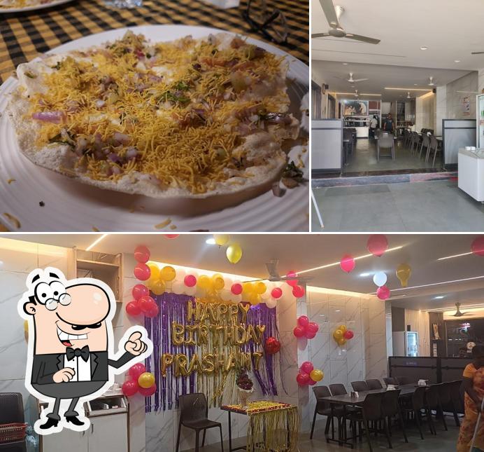 The photo of Sai Chandrani Pure Veg’s interior and pizza