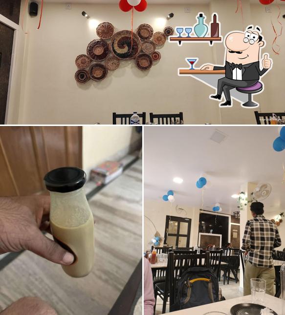Take a look at the photo displaying interior and beverage at De Once More Cafe & Restaurant Best Restaurant in Varanasi Best Cafe in Varanasi