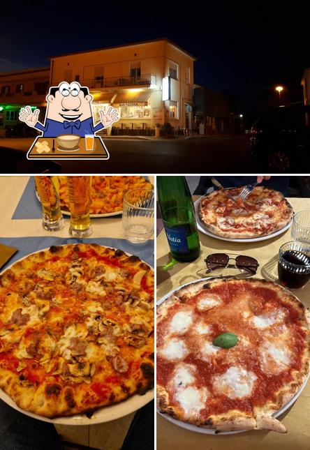 La immagine della cibo e esterno di Pizza In Piazza